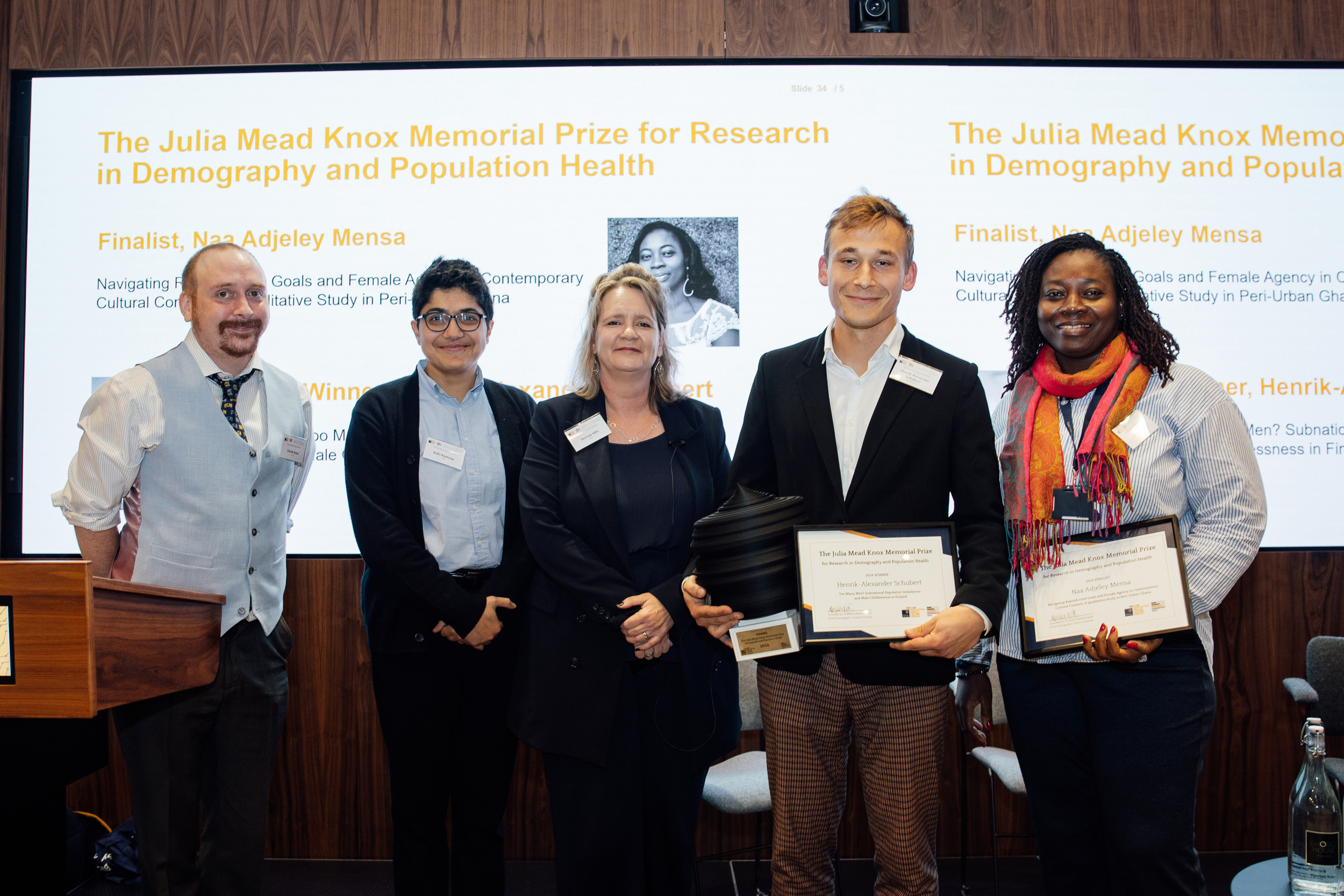 Left to right: Jury members Dr Charles Rahal, Professor Ridhi Kashyap and Professor Melinda Mills presenting The Julia Mead Knox Memorial Prize for Research in Demography and Population Health to University of Oxford DPhil students Henrik-Alexander Schubert and Naa Adjeley Mensah. 