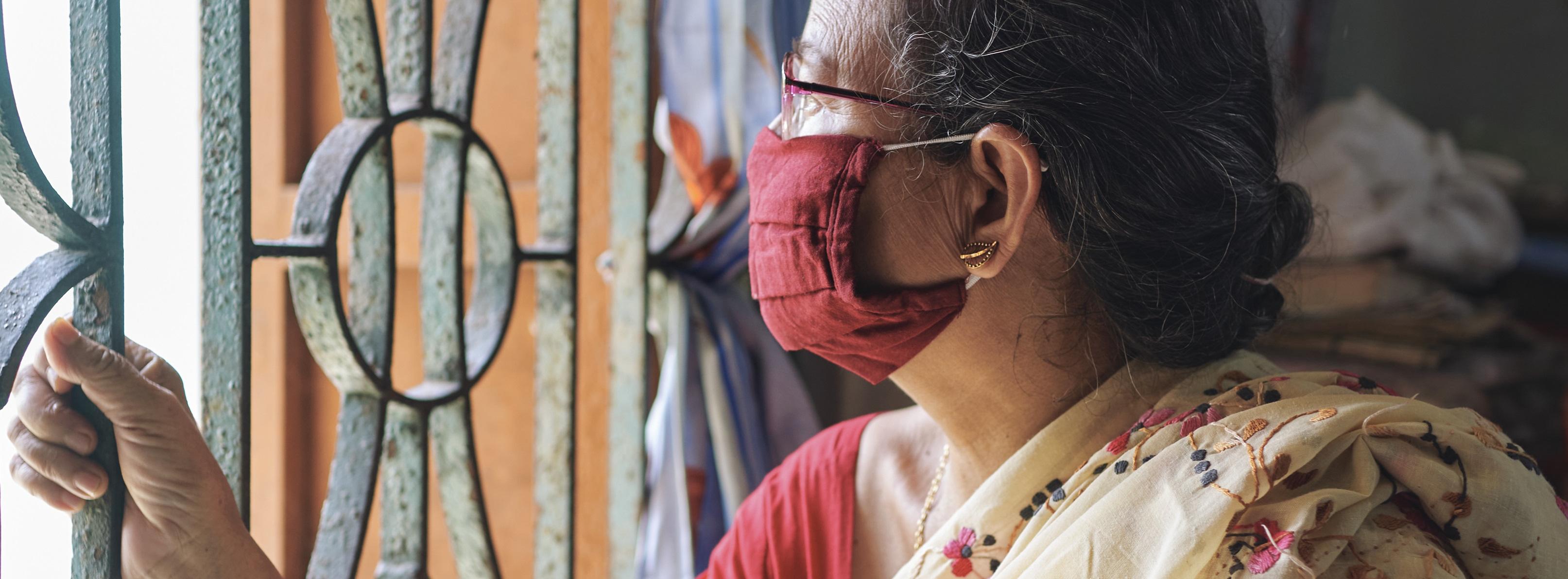 An Indian woman inside her house during lockdown in Kolkata - stock photo