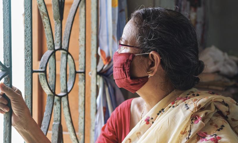 An Indian woman inside her house during lockdown in Kolkata - stock photo