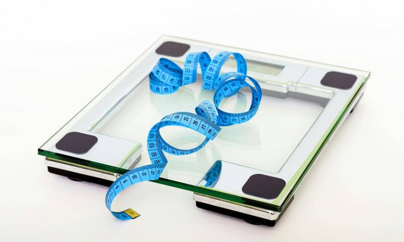 Blue Tape Measuring on Clear Glass Square Weighing Scale